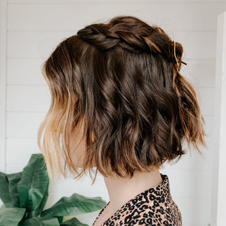 Image of model with short brunette hair styled in a braid do with curls done by the beachwaver S.75.