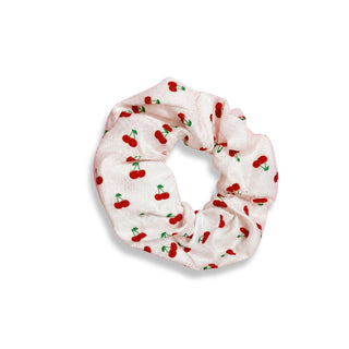 Scrunchie with cherry pattern on a white background