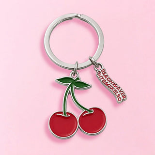  Keychain with cherry design and 'Beach Waver and @ITSMEKELSC' tag on a pink background