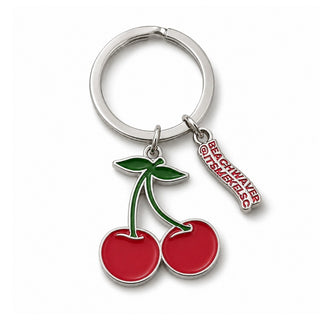 Keychain with cherry design and 'Beach Waver and @ITSMEKELSC' tag on a white background