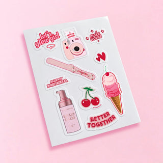 Sheet of stickers with various designs on a pink background
