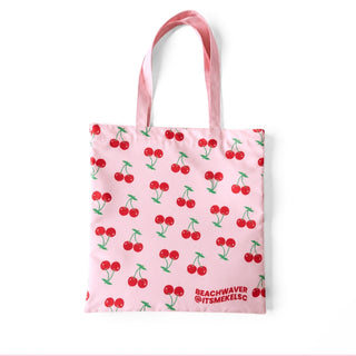 Tote bag with cherry pattern with 'Beachwaver and @ITSMEKELSC' tag on a white background