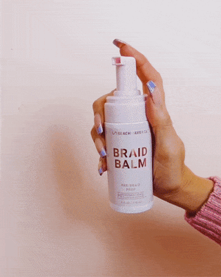 Gif of Braid Balm- Pre Braid Prep being pumped into hand a rubbed around.
