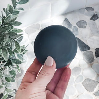Image of someone holding the Charcoal shampoo bar