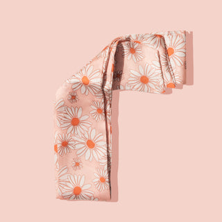 Image of pink daisy hair scarf on pink background