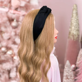 Image of mannequin with long strawberry blonde hair styled by a Beachwaver Hair Tool wearing a Black Silk Knotted Headband.