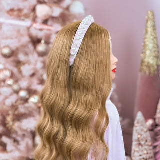 Image of mannequin with long strawberry blonde hair styled by a Beachwaver Hair Tool wearing a Pink Faux Pearl Velvet Headband.