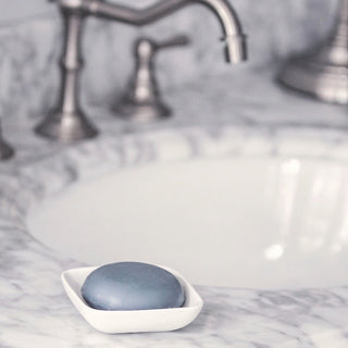 Image of Charcoal bar on bathroom counter in a soap dish