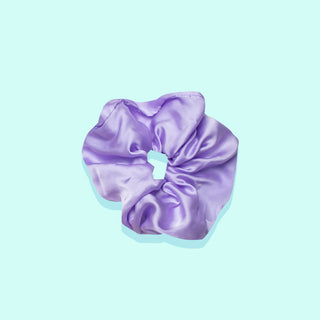Image of purple scrunchie on teal background