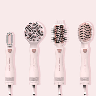 Picture of Beachwaver Pink Blow Brush with attachments (from left to right) dryer, diffuser, round brush, smoothing brush.