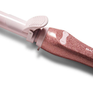 Up close image of pink glitter the one Beachwaver's rotating buttons