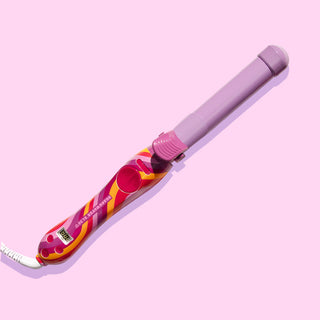 Image of purple and swirled red, yellow, and purple Beachwaver S1.25 on a purple background.