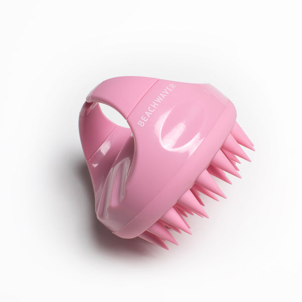 Image of Pink Large Root Therapy Scalp Massager from the side showing the handle and the massaging spikes. 